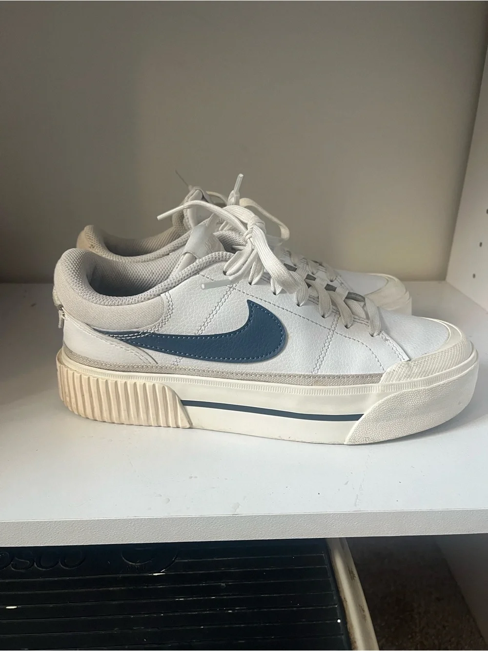 Nike White Low-Top Sneakers with Blue Swoosh